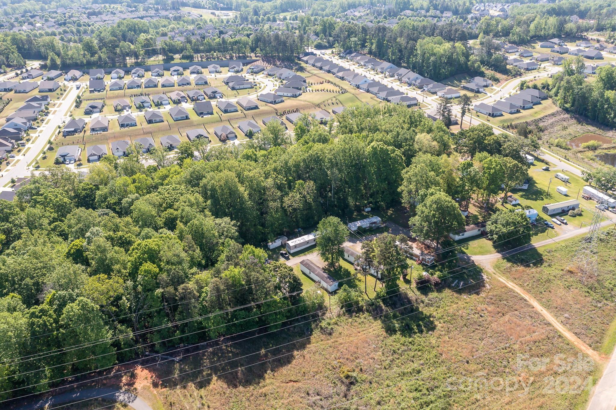 4650 Bright Road Charlotte, NC 28214 - Photo 3 of 16 a view of a lake with houses