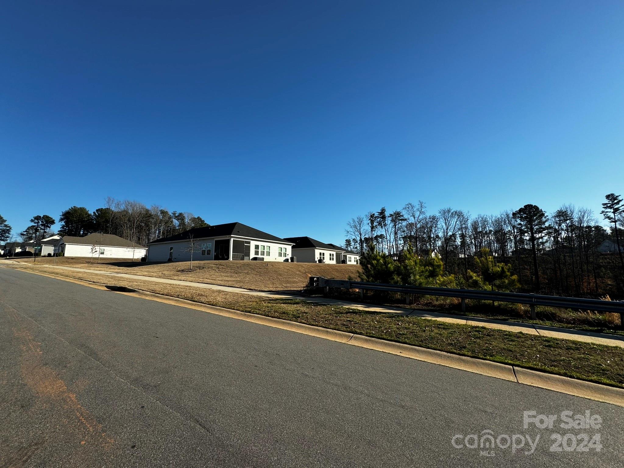 4650 Bright Road Charlotte, NC 28214 - Photo 4 of 16 a view of city street with a car parked in front of it