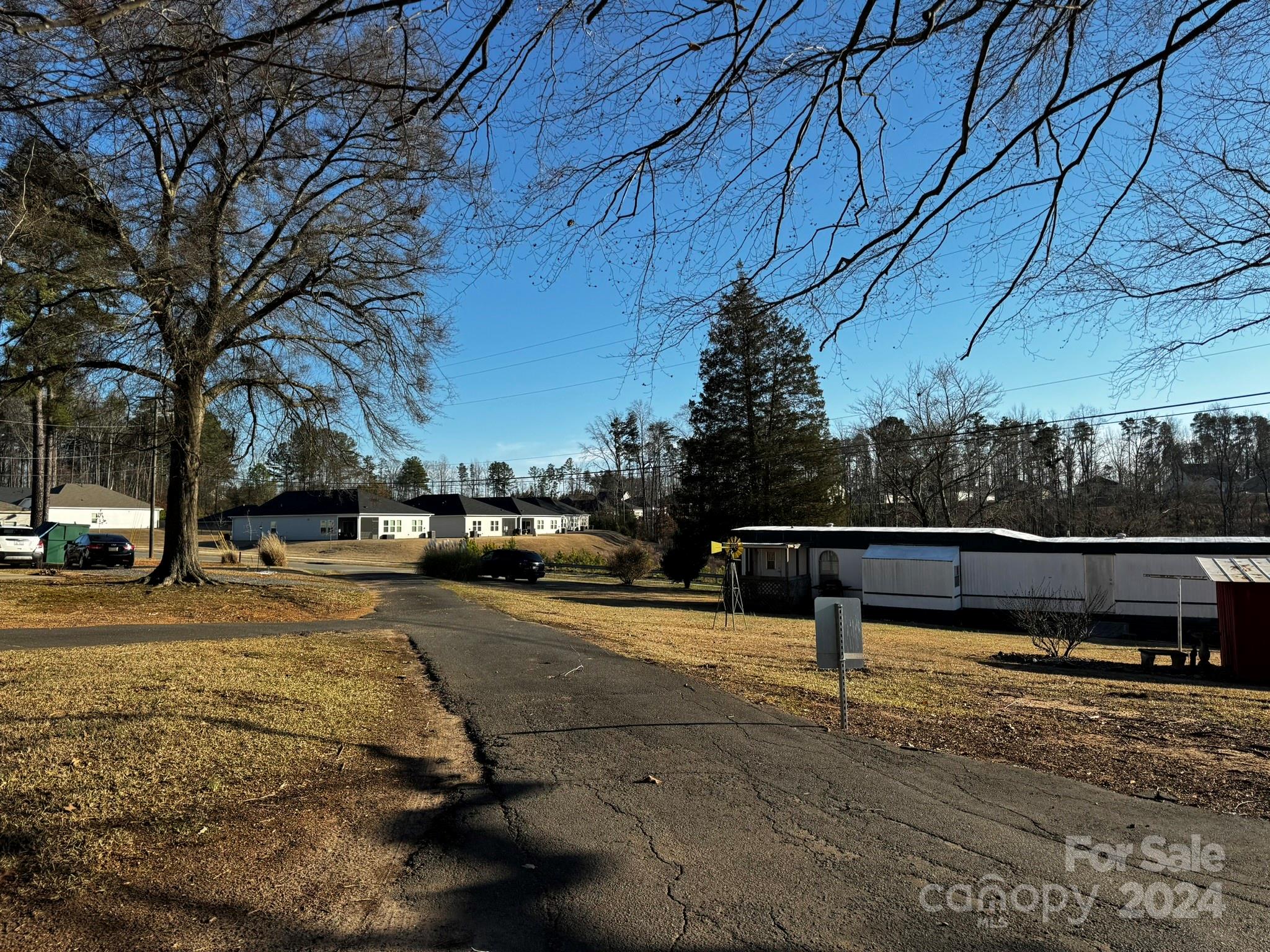 4650 Bright Road Charlotte, NC 28214 - Photo 10 of 16 a view of street with wooden bench