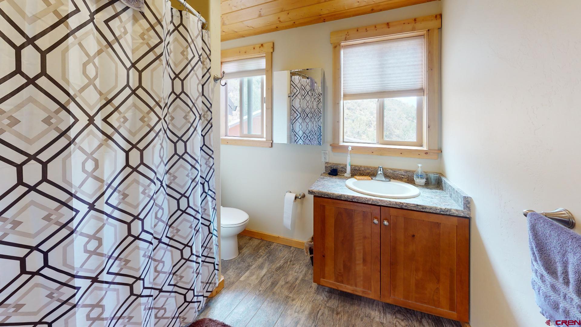 16800 Grange Road Paonia, CO 81428 - Photo 13 of 37 a bathroom with a granite countertop sink and a mirror