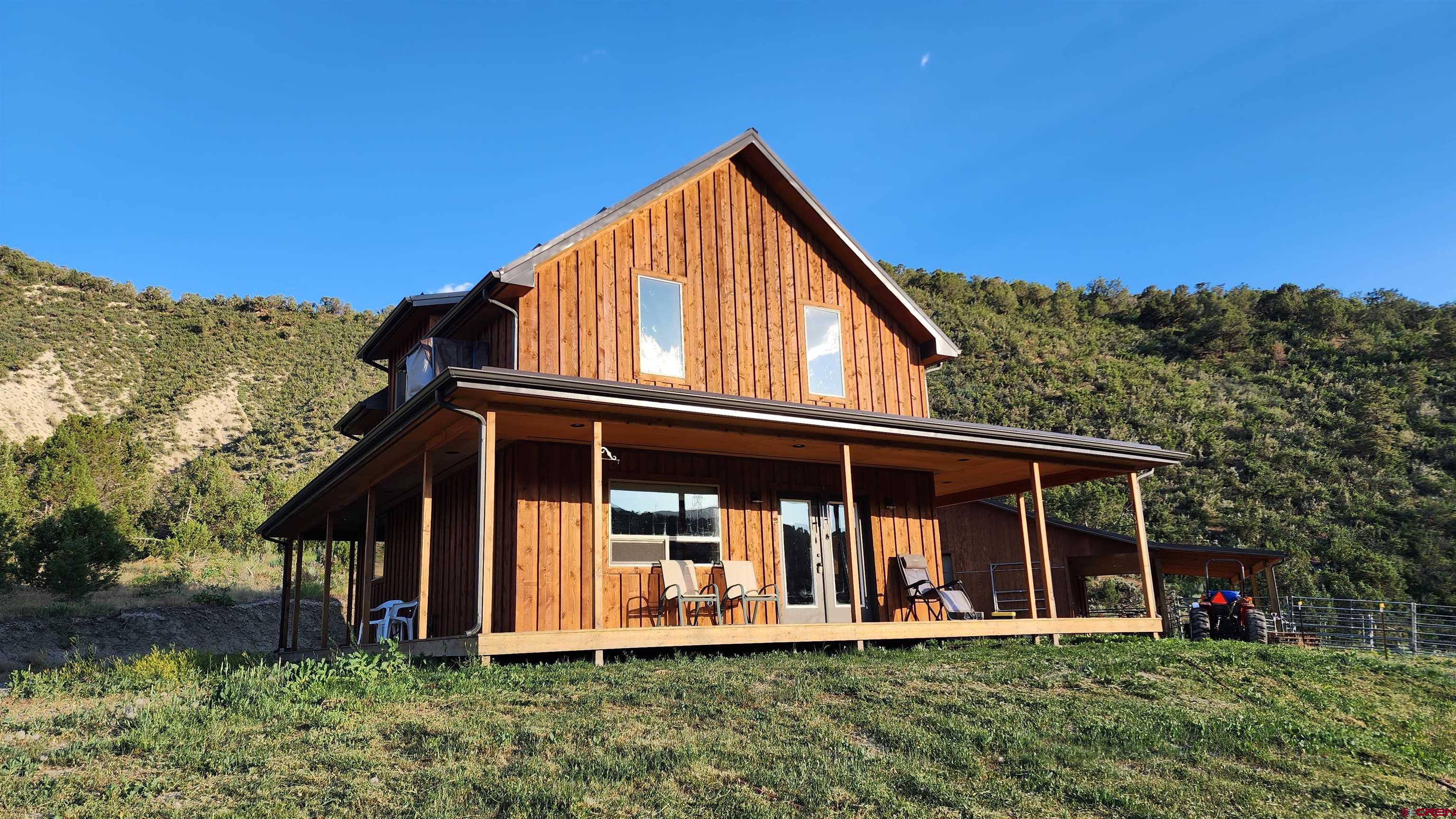 16800 Grange Road Paonia, CO 81428 - Photo 2 of 37 a front view of a house with garden