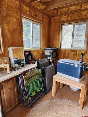 a bedroom with furniture and a window
