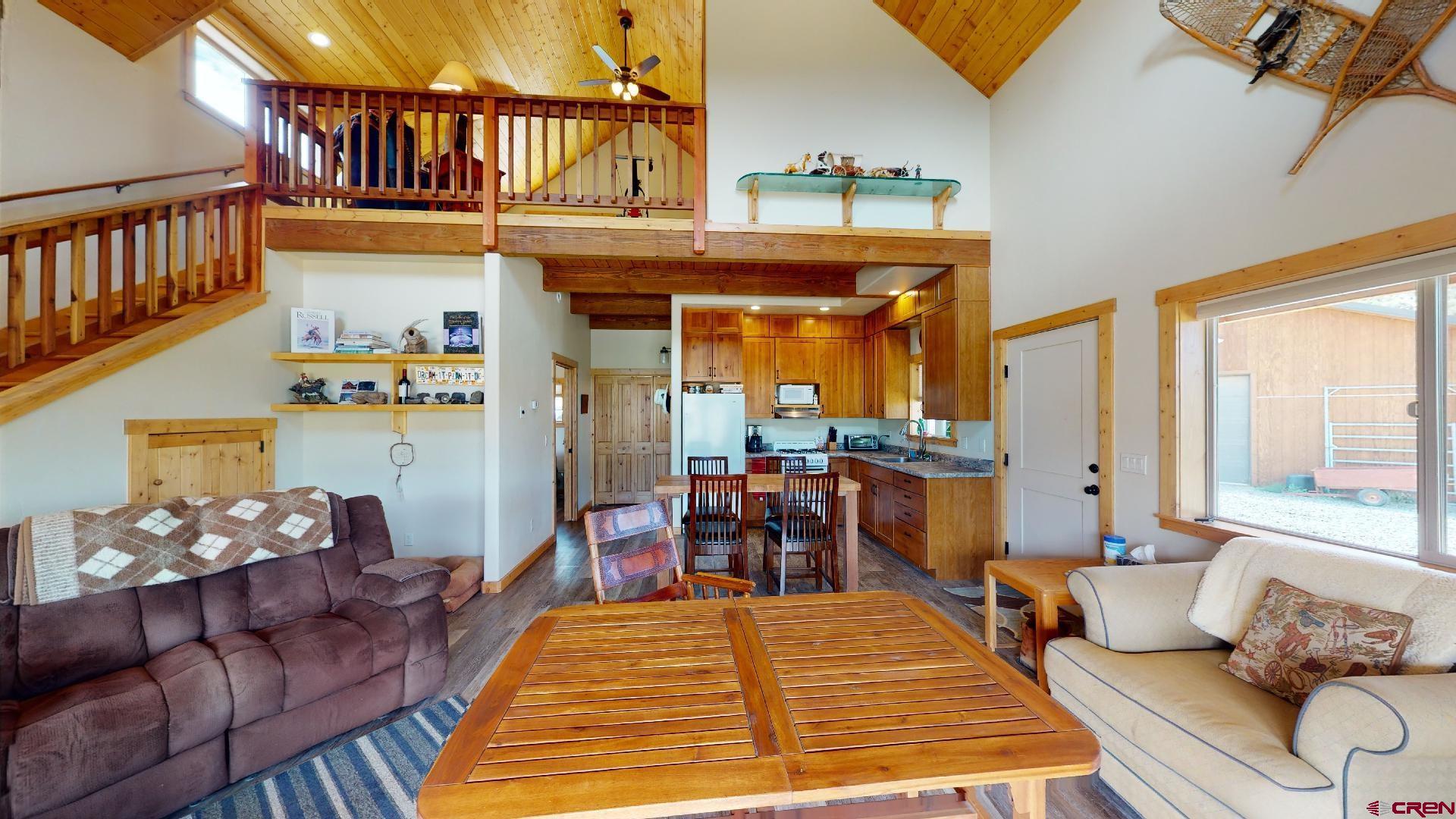 16800 Grange Road Paonia, CO 81428 - Photo 7 of 37 a bedroom with furniture and a wooden floor