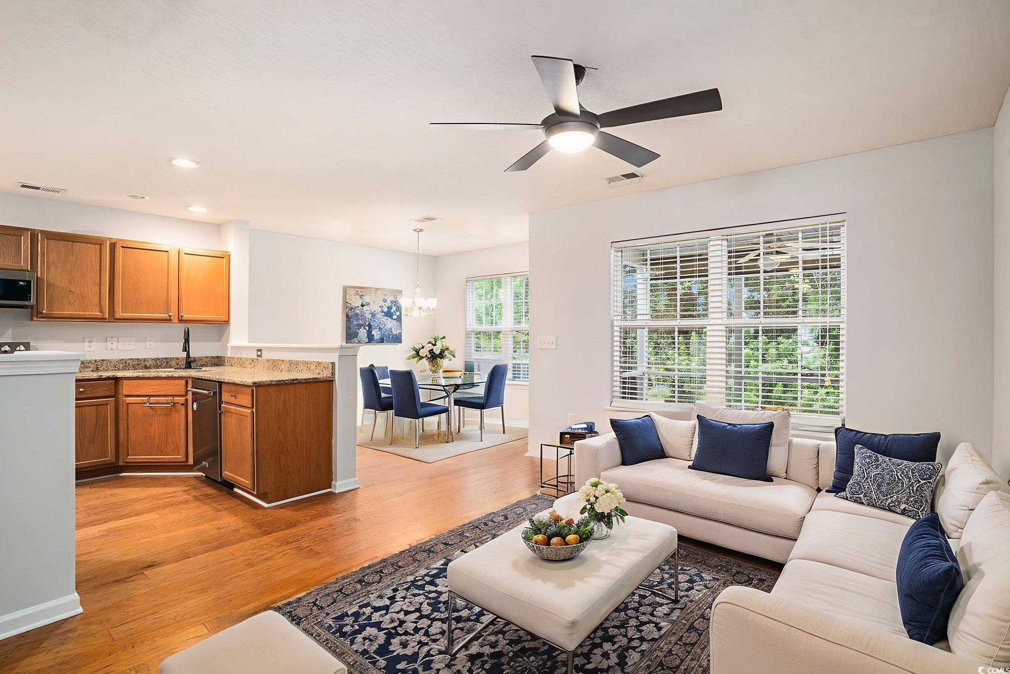 1024 Stanton PI, Unit 1024 Myrtle Beach, SC 29579 - Photo 3 of 26 Living room with ceiling fan, light wood-style flooring