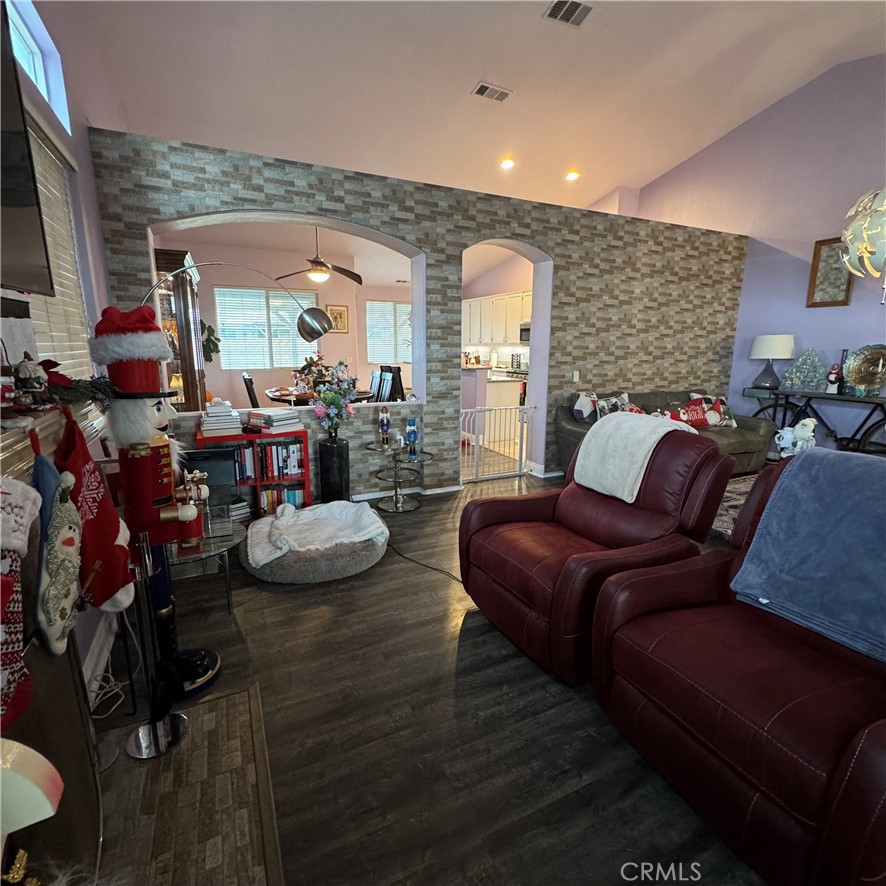 44528 Camolin Lane Lancaster, CA 93534 - Photo 23 of 75 a living room with furniture and a flat screen tv