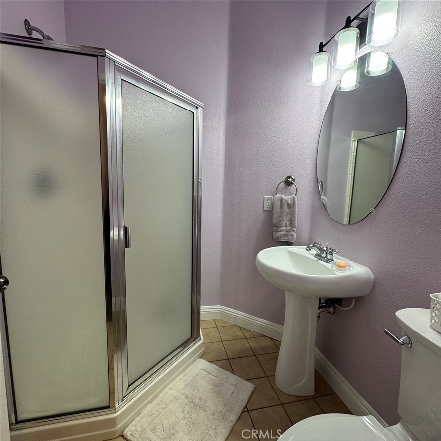 44528 Camolin Lane Lancaster, CA 93534 - Photo 26 of 75 a bathroom with a sink toilet and a mirror