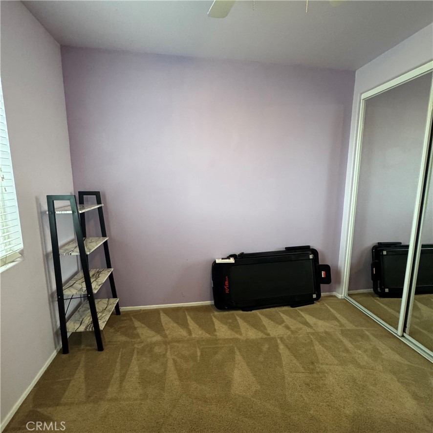 44528 Camolin Lane Lancaster, CA 93534 - Photo 28 of 75 a bedroom with a bed and a chair