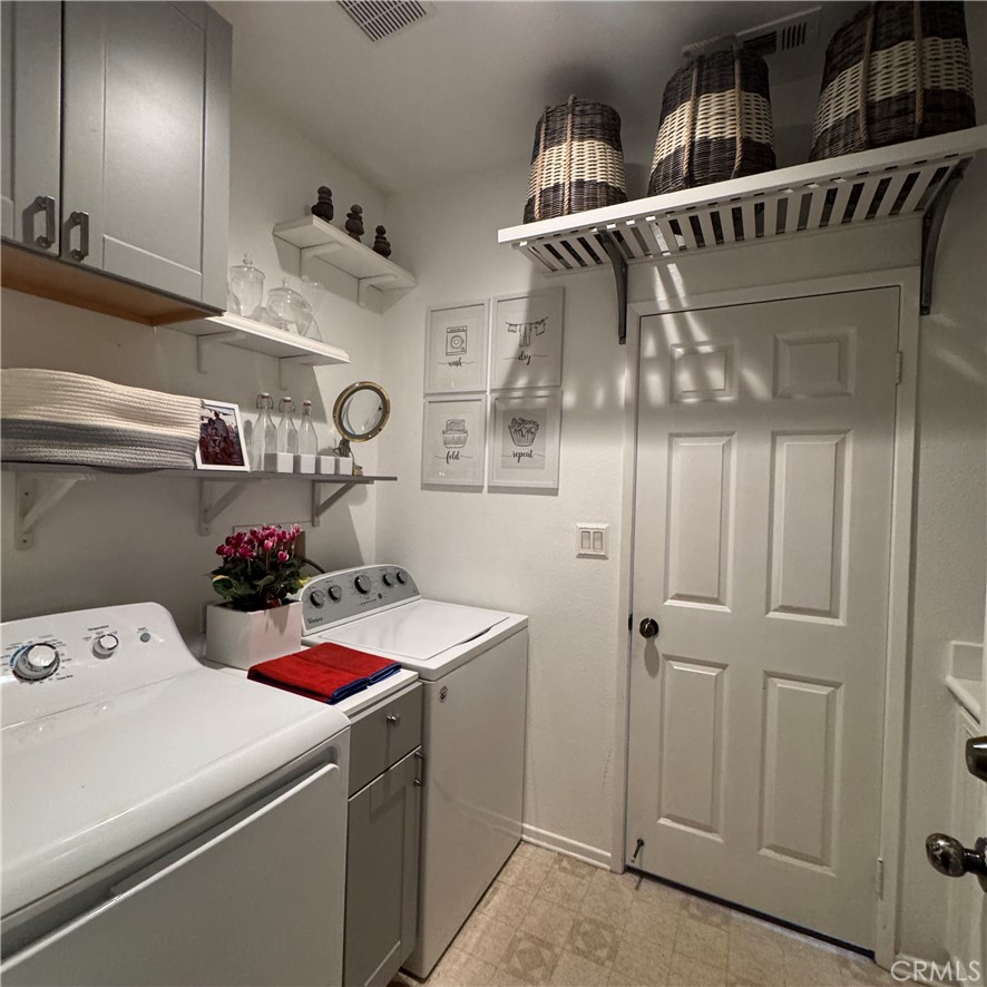 44528 Camolin Lane Lancaster, CA 93534 - Photo 33 of 75 a storage room with washer and dryer