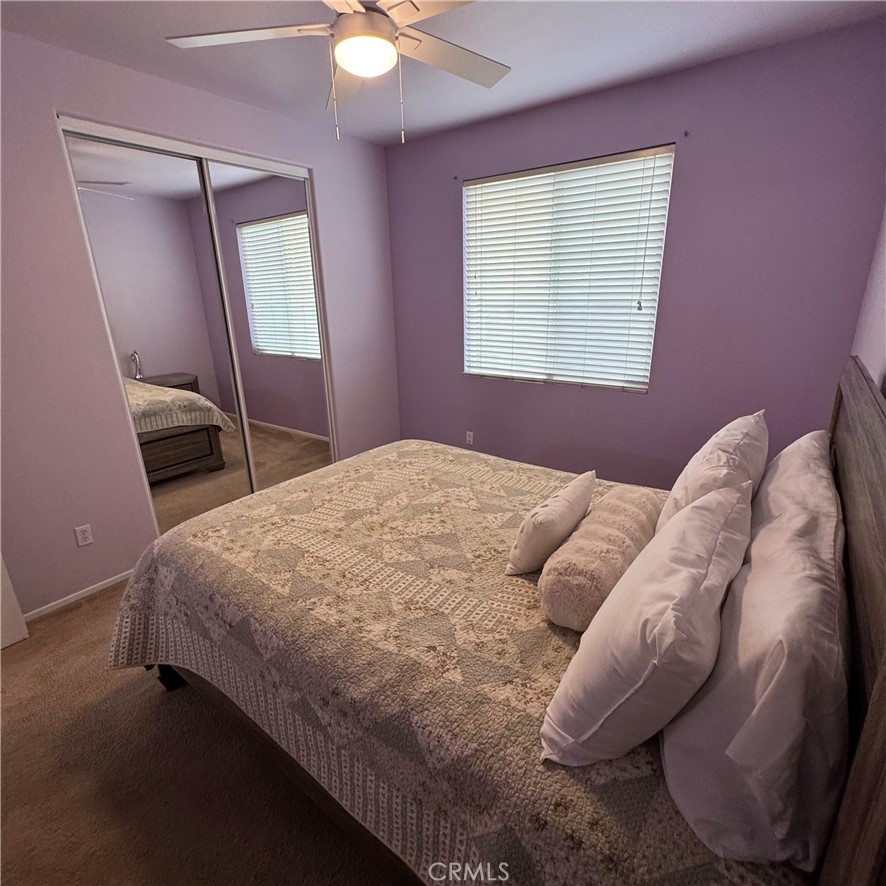 44528 Camolin Lane Lancaster, CA 93534 - Photo 37 of 75 a bed sitting in a bedroom next to a window