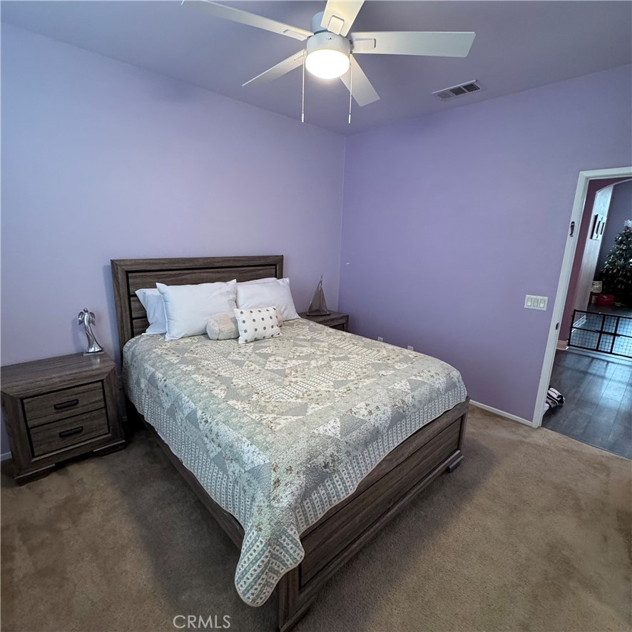 44528 Camolin Lane Lancaster, CA 93534 - Photo 38 of 75 a bed sitting in a bedroom next to a window