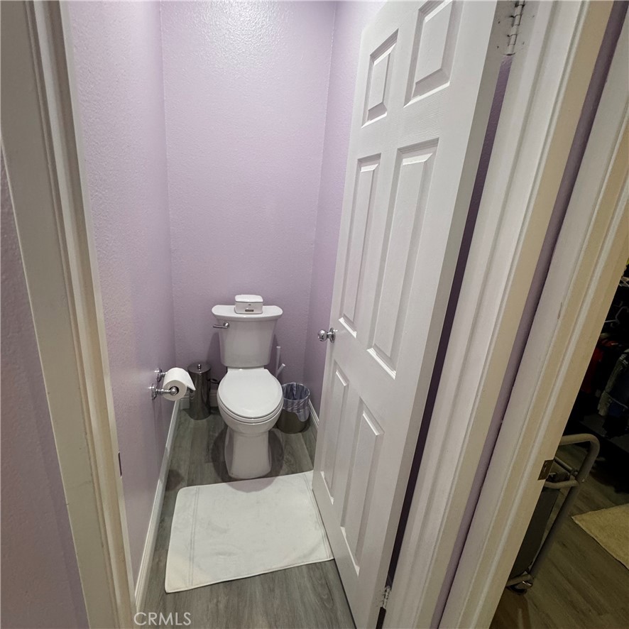 44528 Camolin Lane Lancaster, CA 93534 - Photo 50 of 75 a white toilet sitting next to a small bathroom