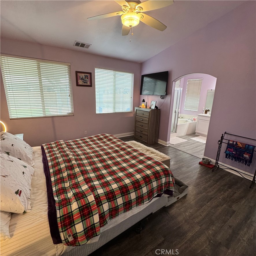 44528 Camolin Lane Lancaster, CA 93534 - Photo 5 of 75 a bedroom with a bed and a chandelier