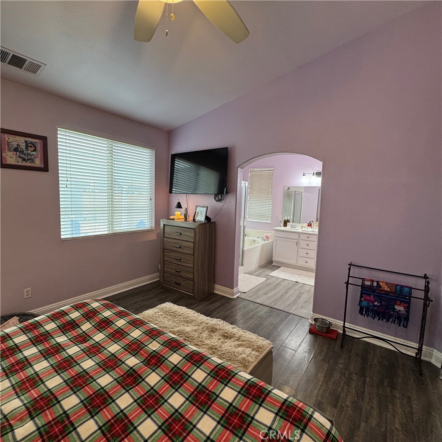 44528 Camolin Lane Lancaster, CA 93534 - Photo 62 of 75 a bedroom with a bed and a television