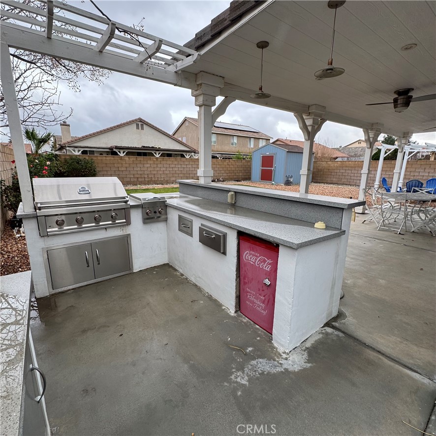 44528 Camolin Lane Lancaster, CA 93534 - Photo 8 of 75 a kitchen with stainless steel appliances granite countertop a stove and a sink