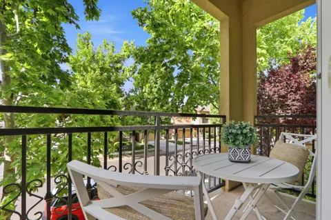a view of a balcony with furniture