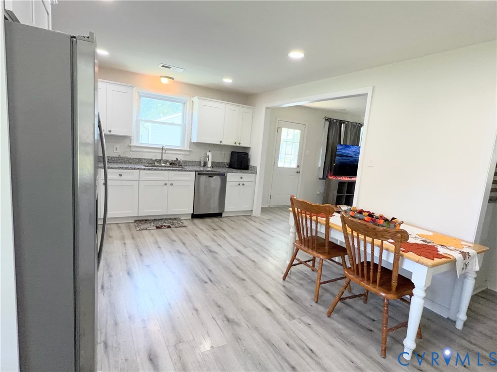 7547 Media Park Road Henrico, VA 23231 - Photo 6 of 21 Bright Kitchen featuring white cabinetry, stainles