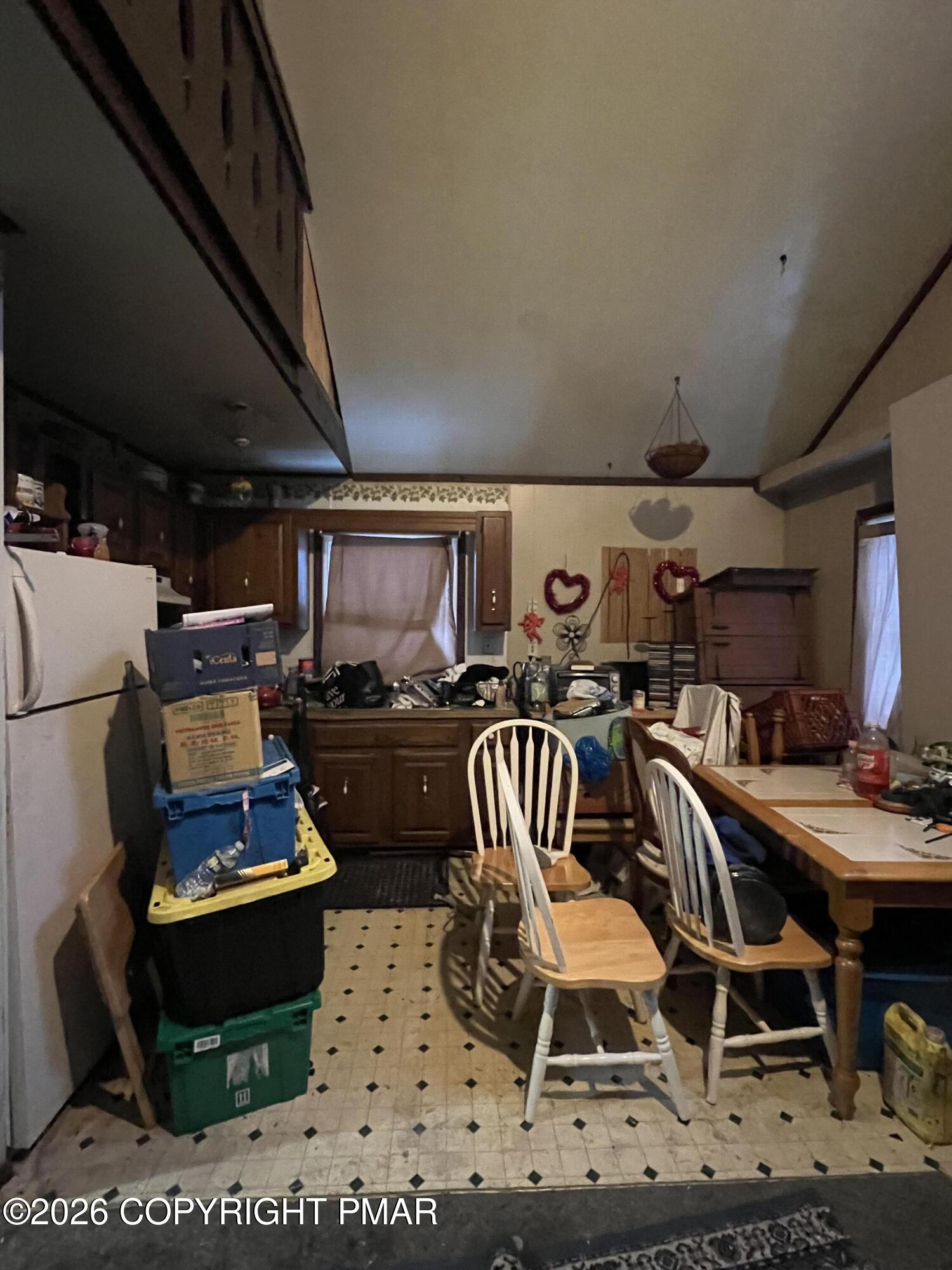 5062 Pine Ridge Road North East Stroudsburg, PA 18302 - Photo 6 of 17 a kitchen with a table chairs and a stove