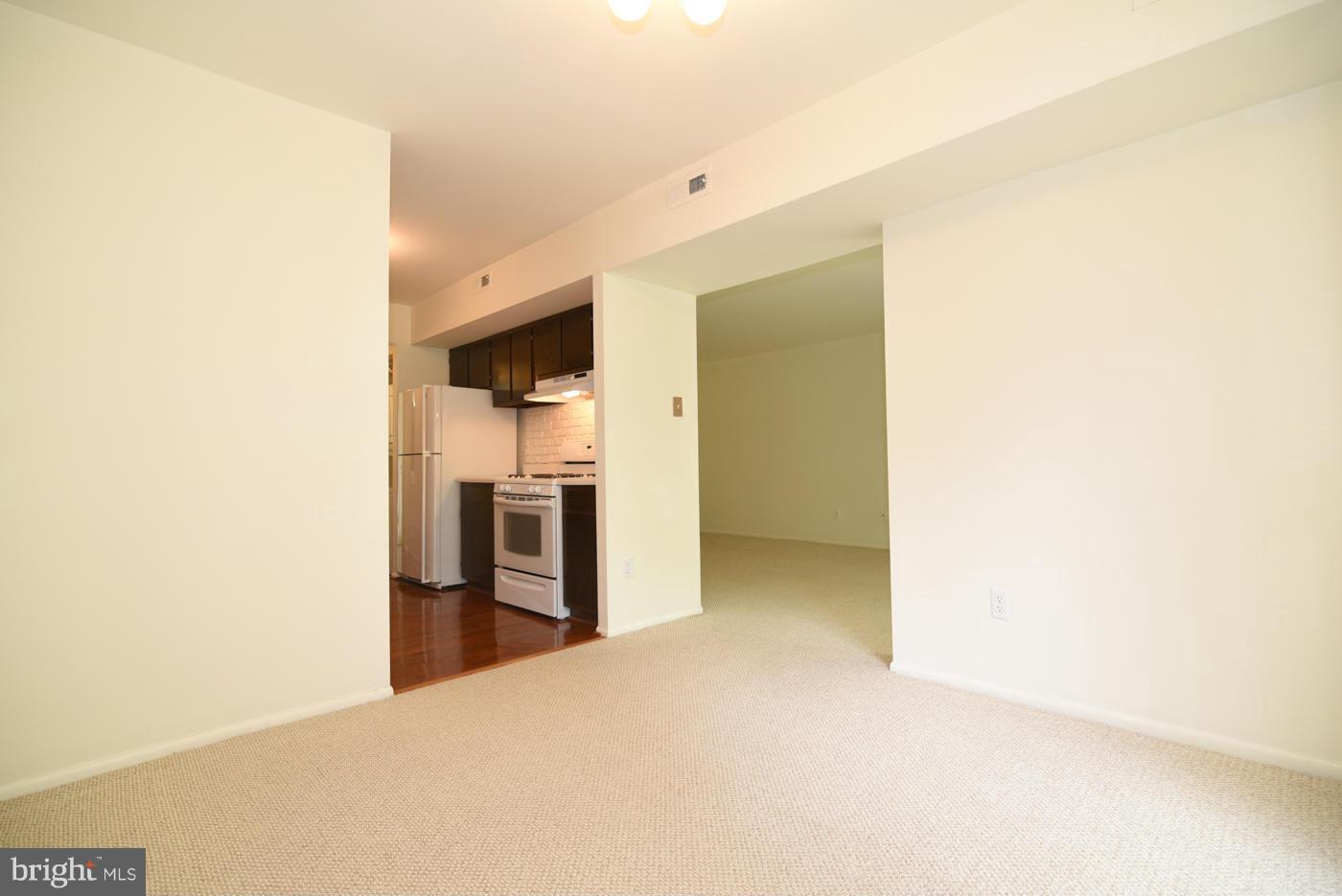 2012 Colts Neck Road, Unit 12A Reston, VA 20191 - Photo 9 of 26 Dining Room into Living Room