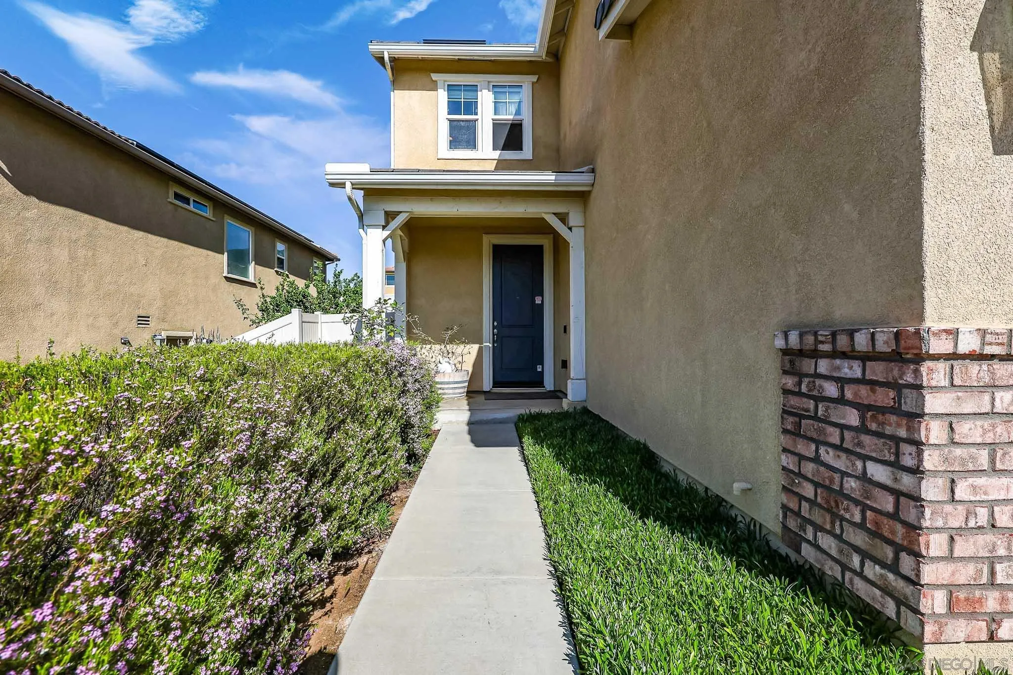 310 Falabella Lane Fallbrook, CA 92028 - Photo 6 of 48 a view of a house with a small yard
