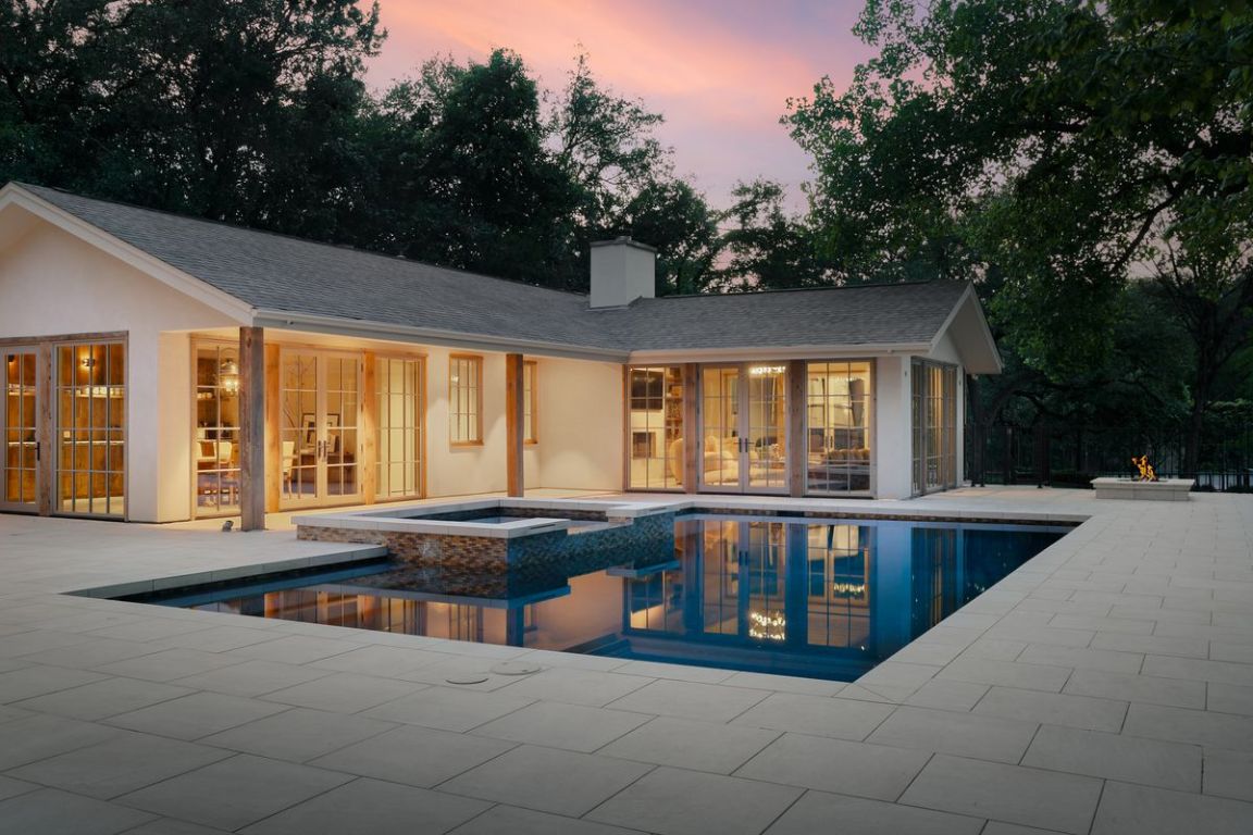 506 Konstanty Circle Austin, TX 78746 - Photo 13 of 23 a view of a swimming pool with a lounge chair
