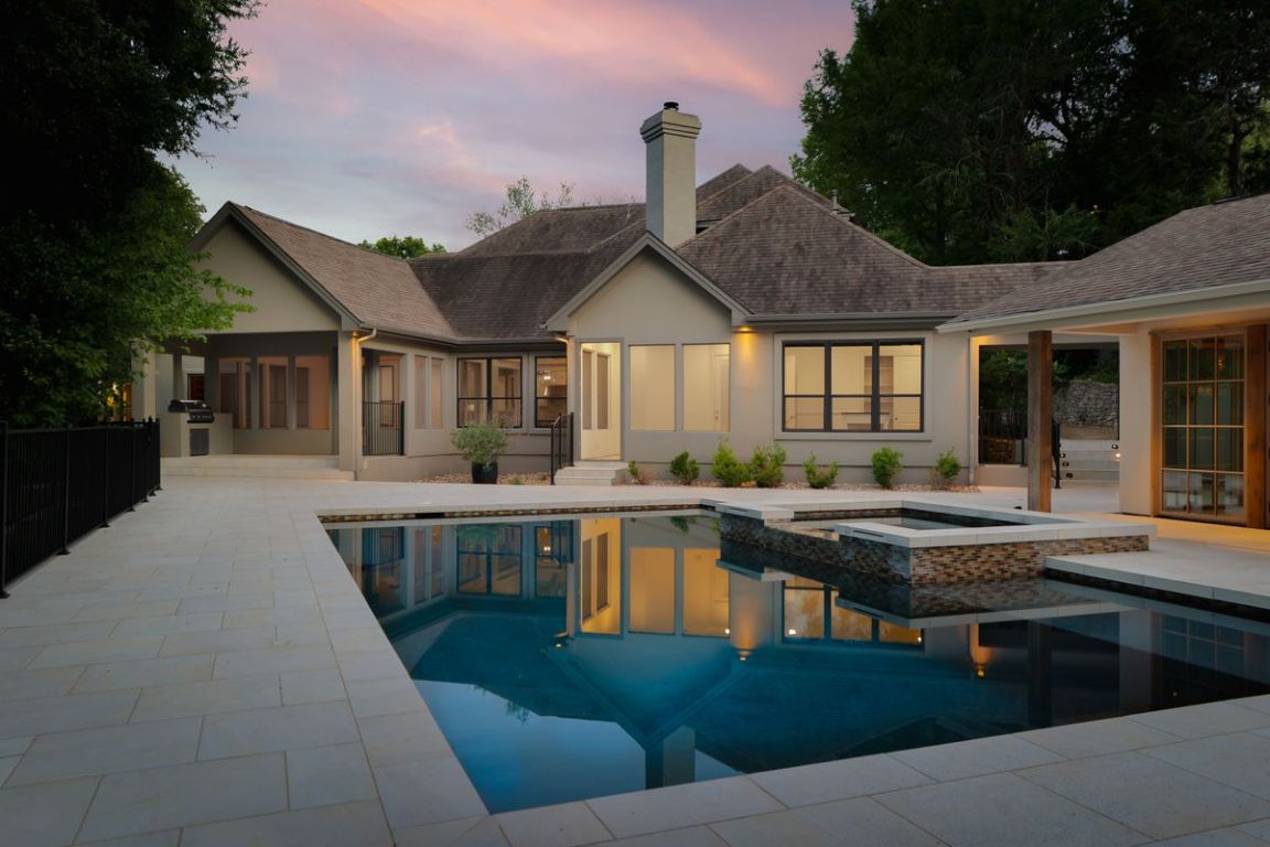 506 Konstanty Circle Austin, TX 78746 - Photo 2 of 23 a living room with stainless steel appliances granite countertop a sink a stove and a wooden floors