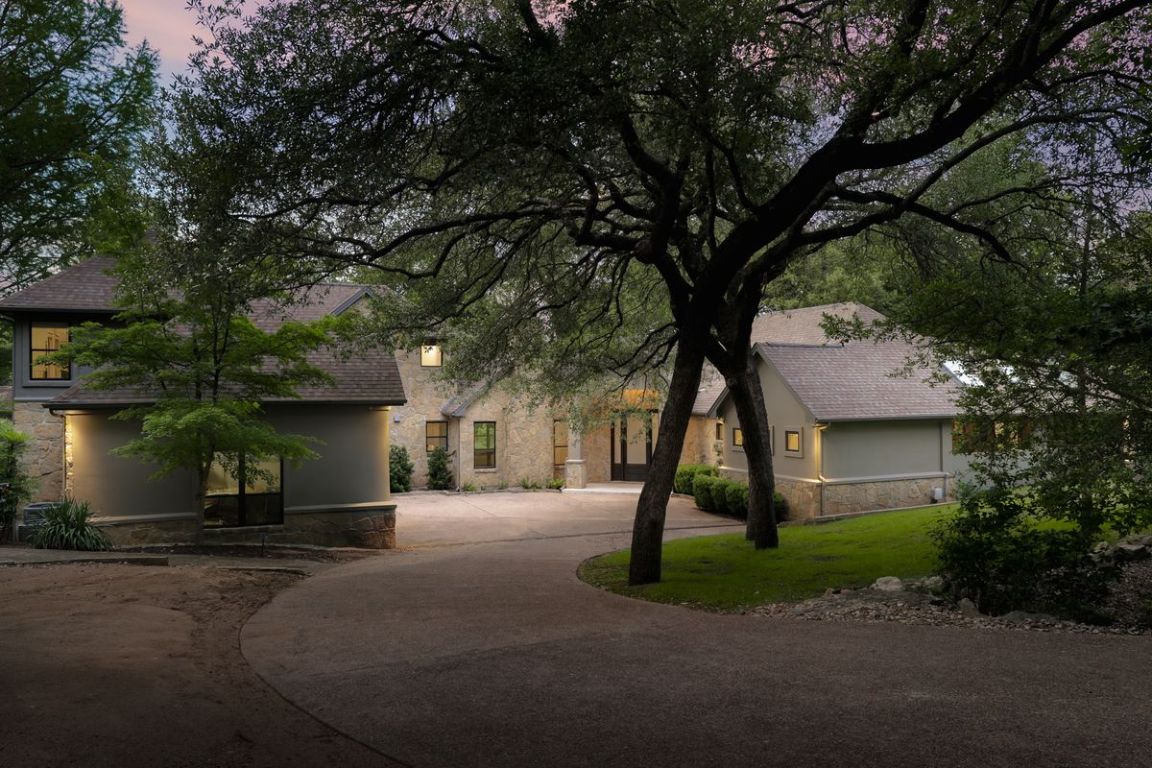 506 Konstanty Circle Austin, TX 78746 - Photo 3 of 23 a front view of a house with a yard