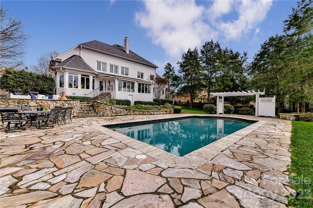 1116 Jericho Lane Charlotte, NC 28270 - Photo 2 of 2 a view of a swimming pool with a lounge chairs