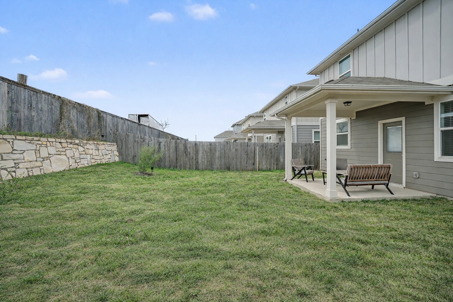 10807 Sentinel Drive Austin, TX 78747 - Photo 16 of 16 Fenced backyard with a patio area