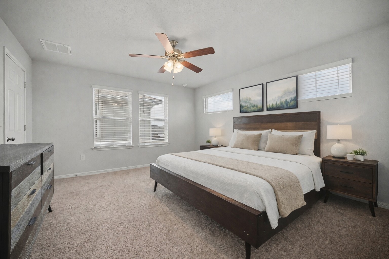 10807 Sentinel Drive Austin, TX 78747 - Photo 7 of 16 Bedroom with light colored carpet and ceiling fan