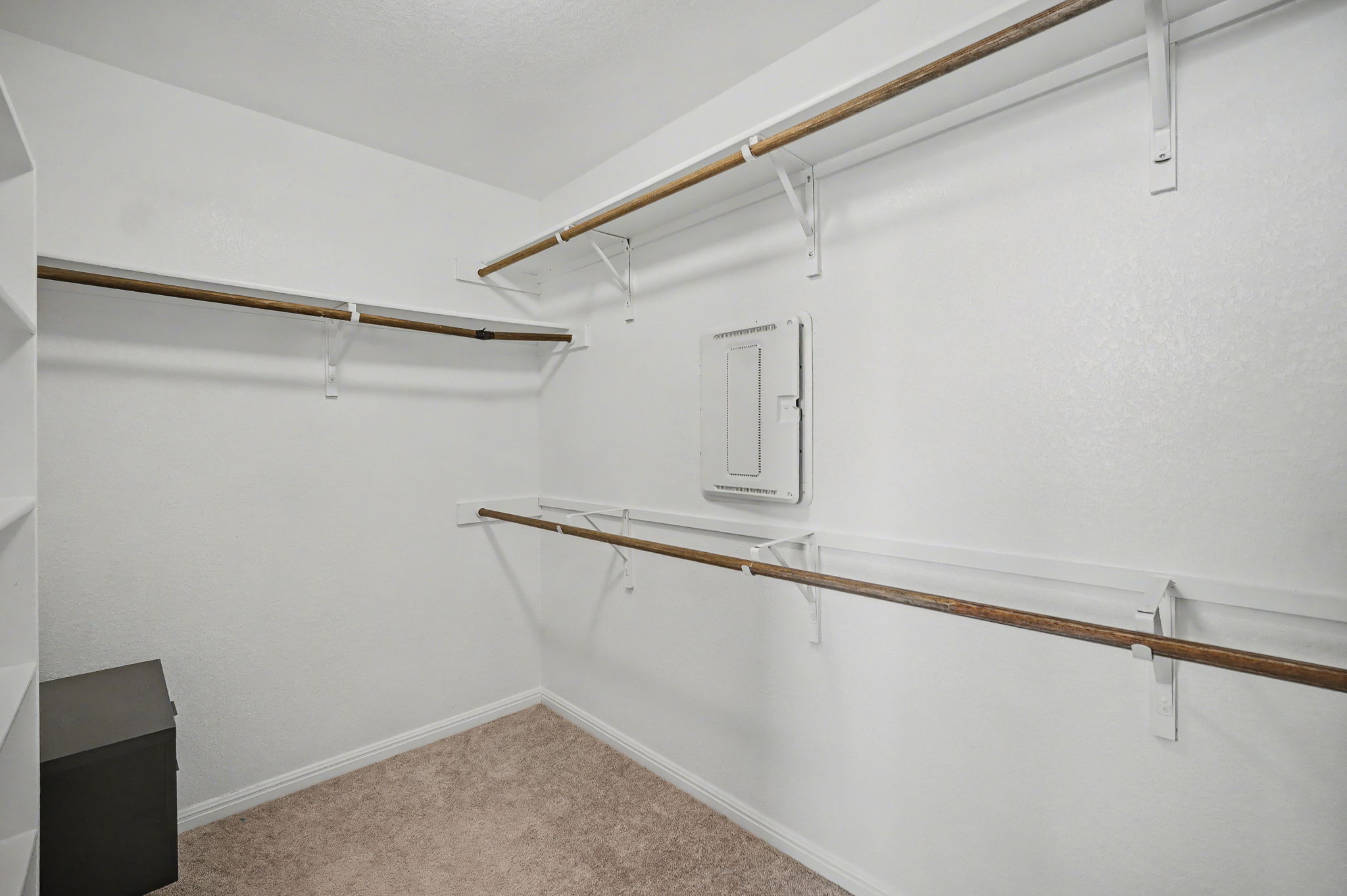 10807 Sentinel Drive Austin, TX 78747 - Photo 8 of 16 Walk in closet with light colored carpet and electric panel