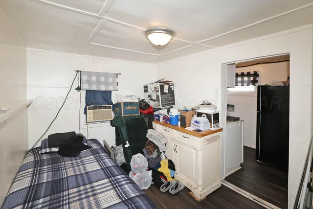 a work room with furniture and a window