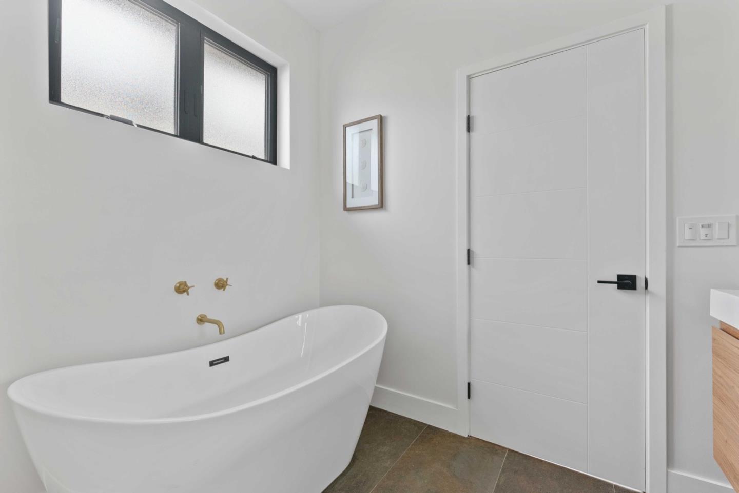 1766 Wagner Avenue Mountain View, CA 94043 - Photo 28 of 38 a white bath tub sitting next to a white cabinet