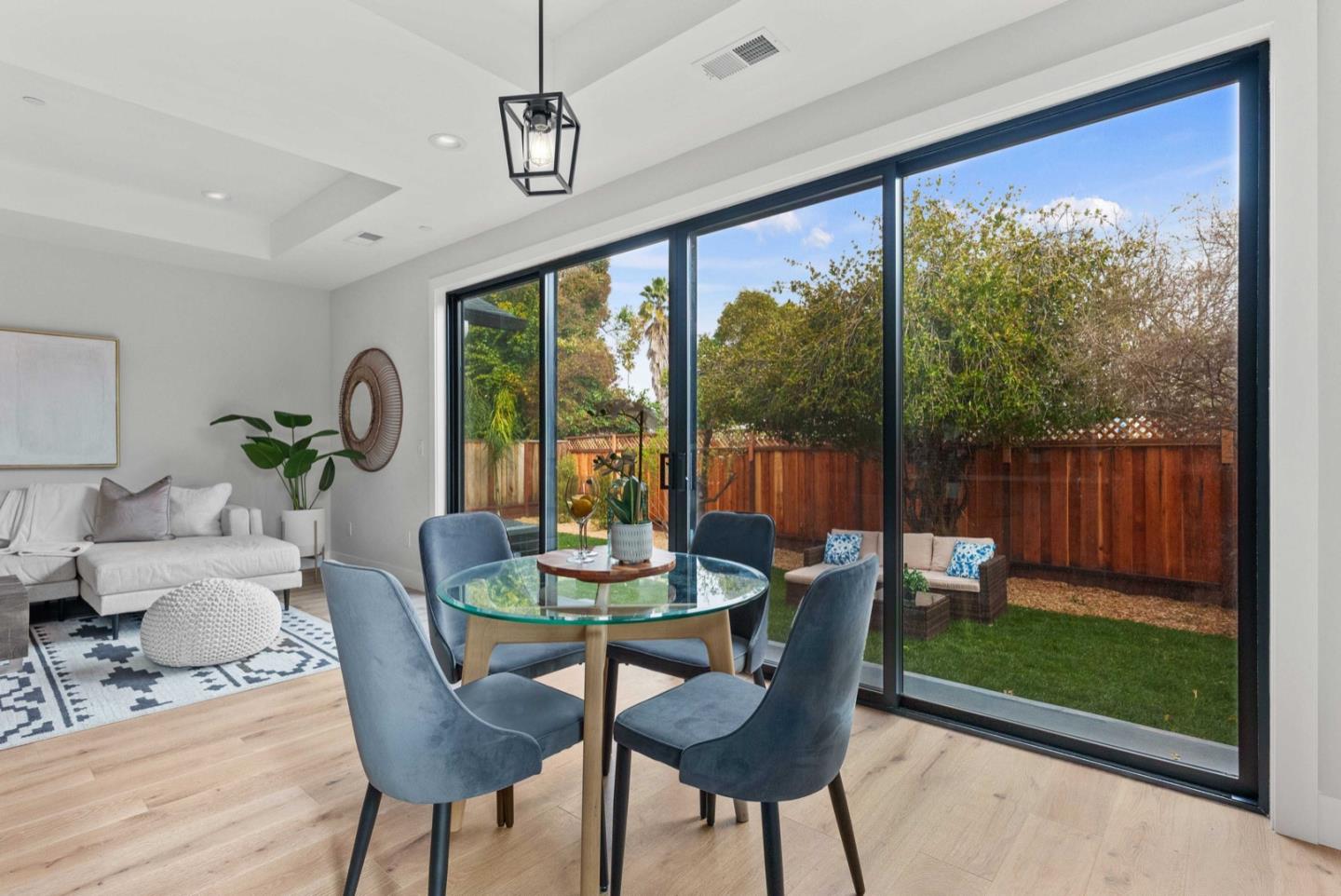 1766 Wagner Avenue Mountain View, CA 94043 - Photo 10 of 38 a dining room with furniture a chandelier and wooden floor