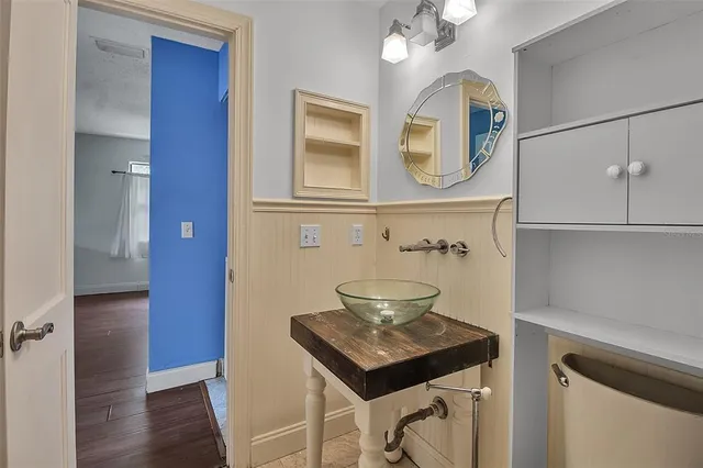 a view of bathroom with a sink a mirror and vanity