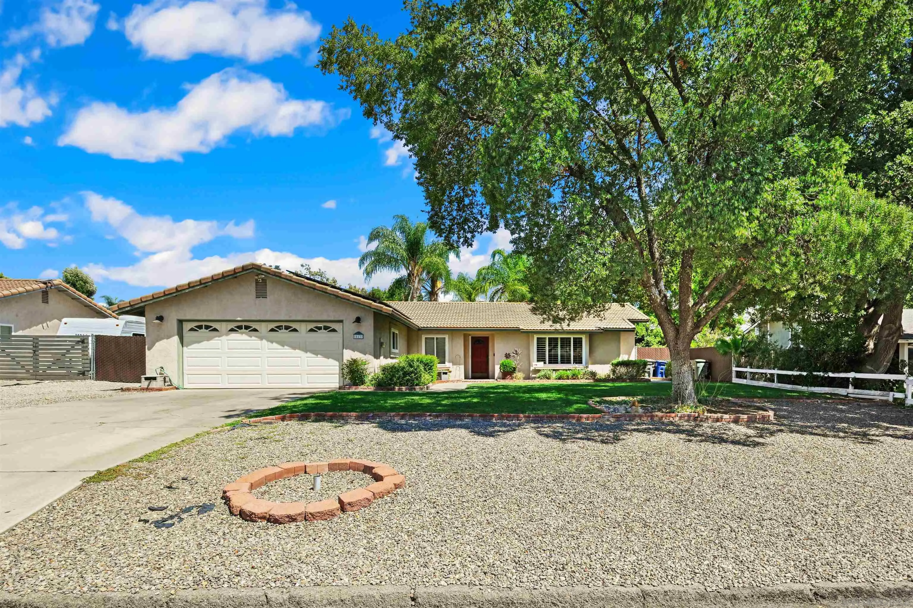 16137 Spangler Peak Road Ramona, CA 92065 - Photo 1 of 1 a front view of a house with garden