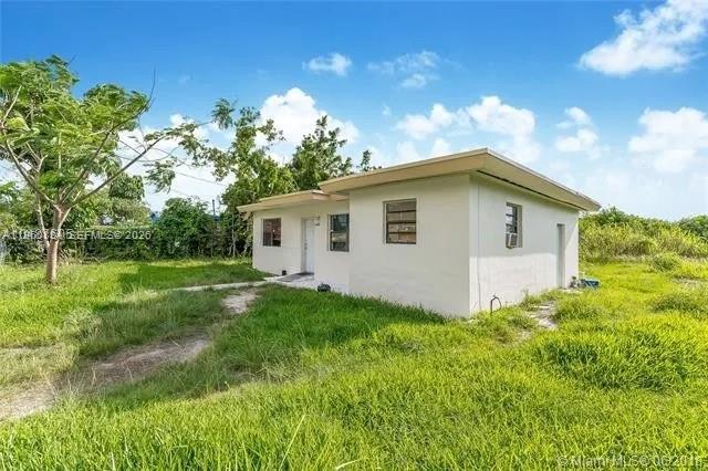 26420 Southwest 138th Court Homestead, FL 33032 - Photo 2 of 5 a view of a house with backyard and garden
