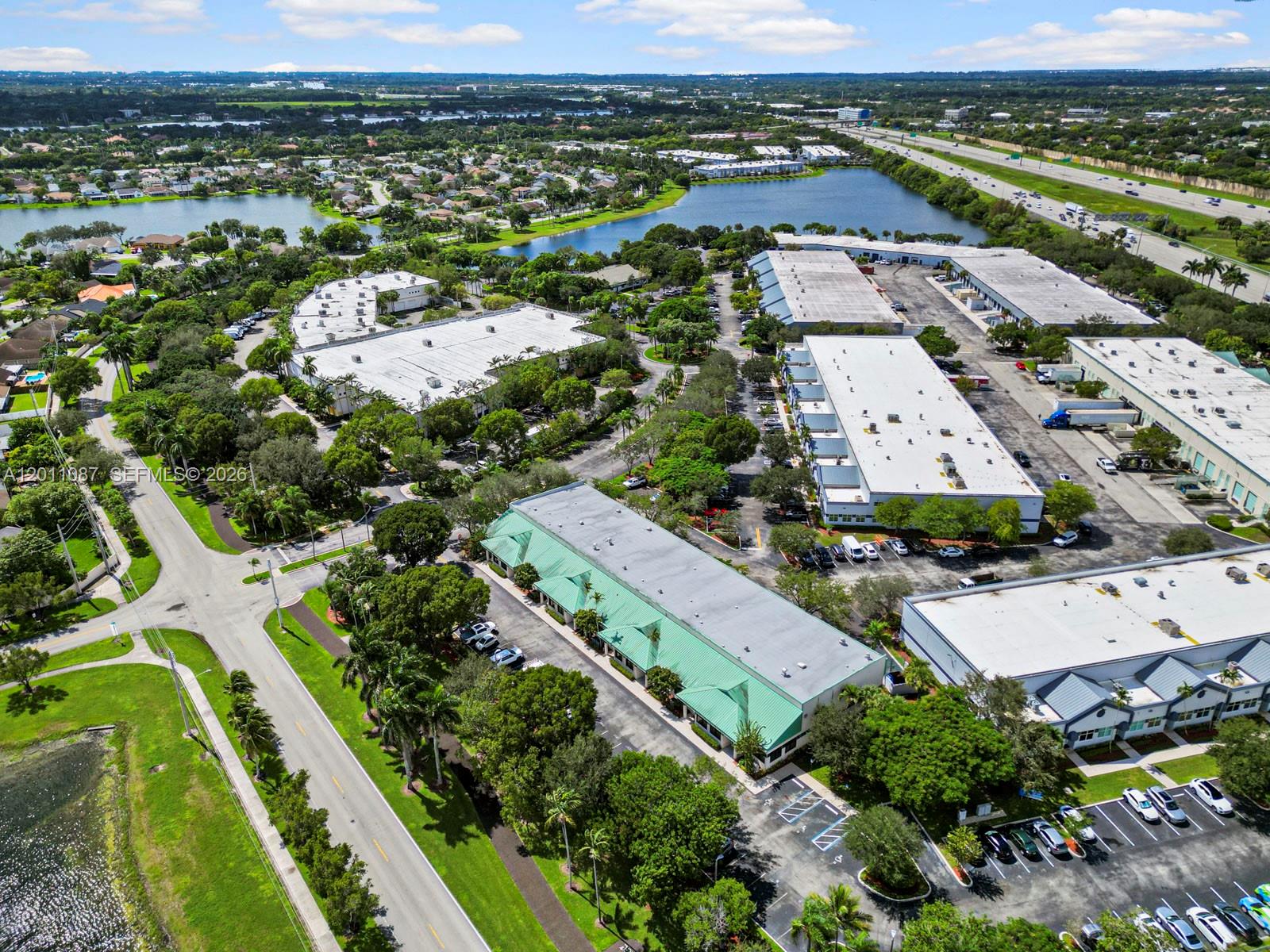 735 Shotgun Road Sunrise, FL 33326 - Photo 2 of 21 an aerial view of residential houses with outdoor space