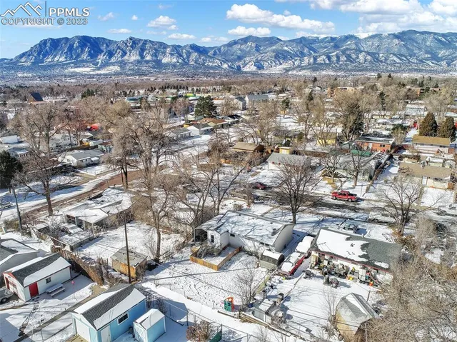 a view of a city with mountains in the background
