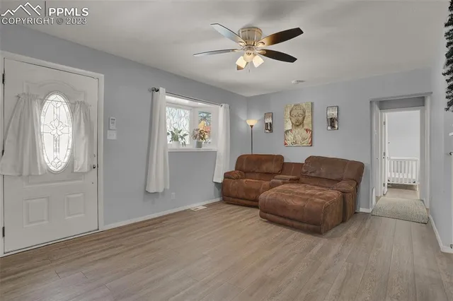a living room with furniture and a window