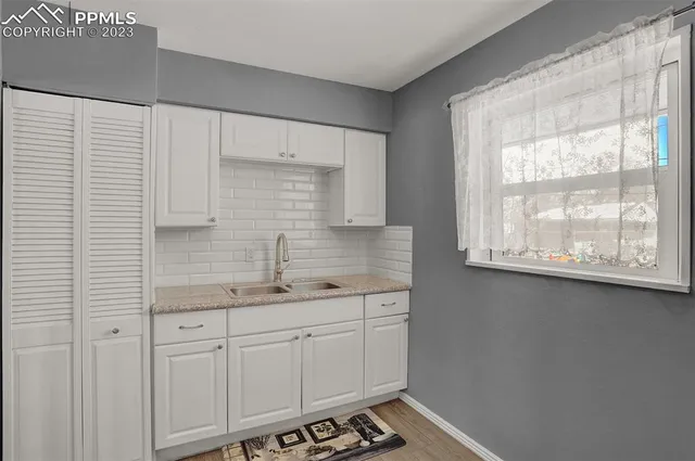 a bathroom with a sink and a window