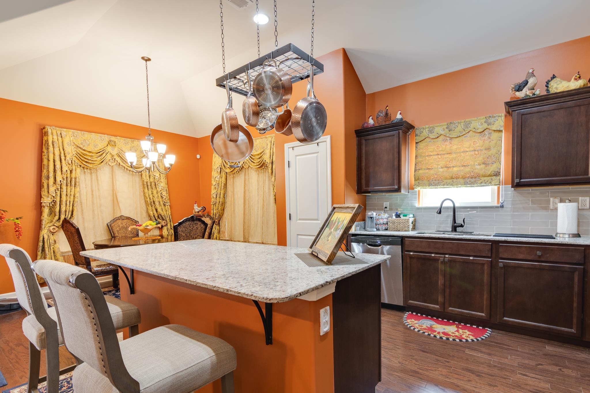 135 Chesnut Rdg Drive Oakland, TN 38060 - Photo 12 of 36 a kitchen with a table chairs sink and wooden floor