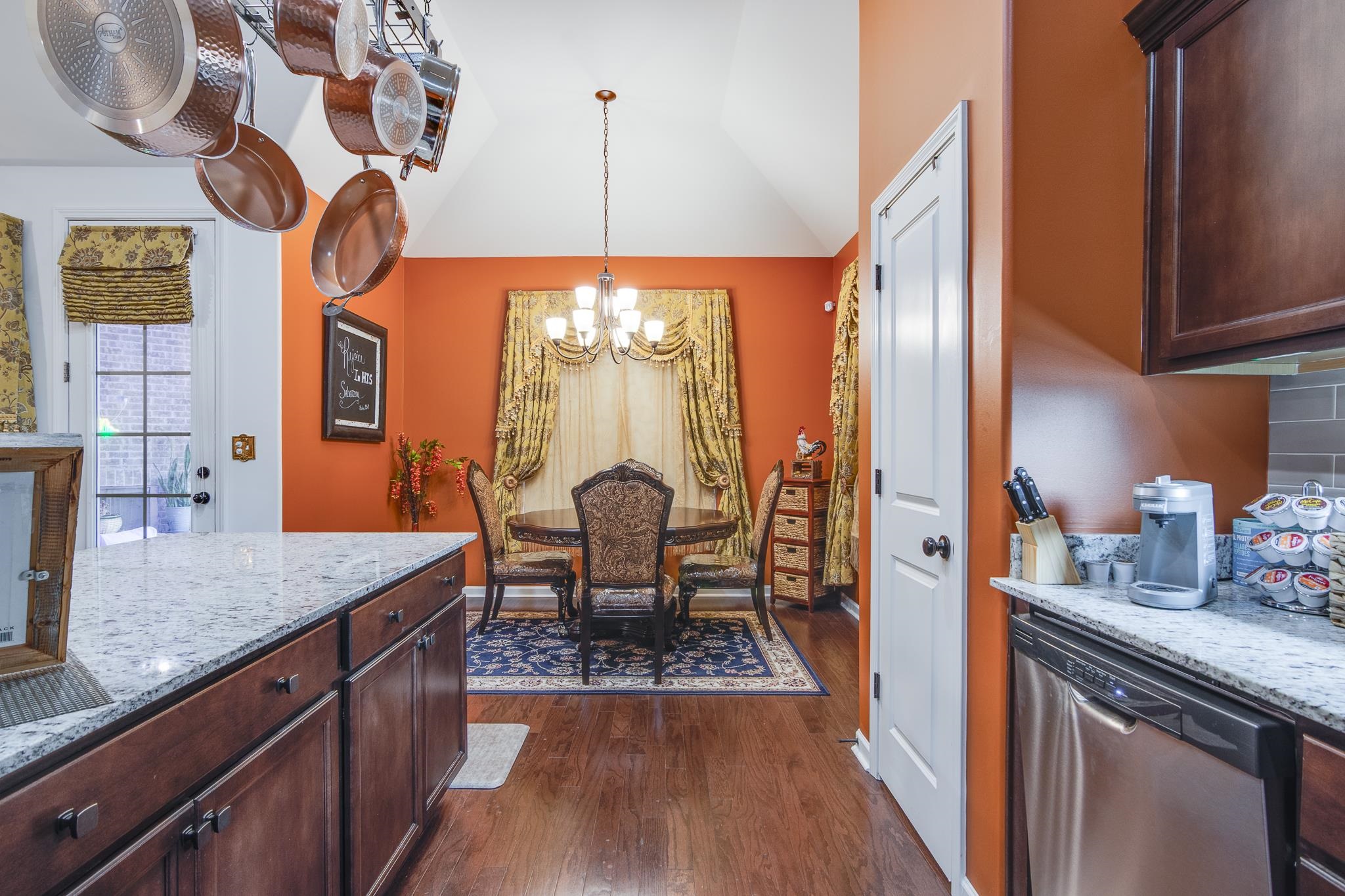 135 Chesnut Rdg Drive Oakland, TN 38060 - Photo 14 of 36 a very nice looking dining room with a large window wooden floor and a chandelier
