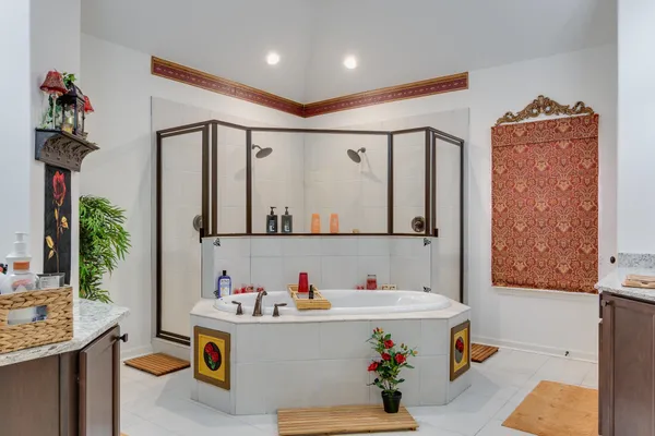 a kitchen with a large window and cabinets
