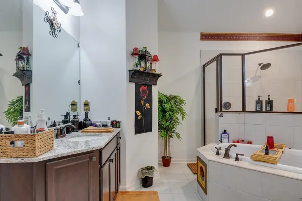 a bathroom with a sink vanity and mirror