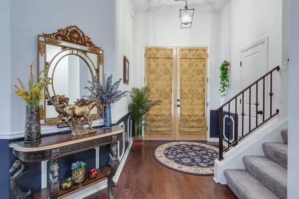 a view of entryway with wooden floor