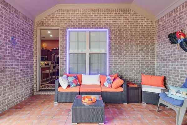 a outdoor living space with furniture and a fireplace