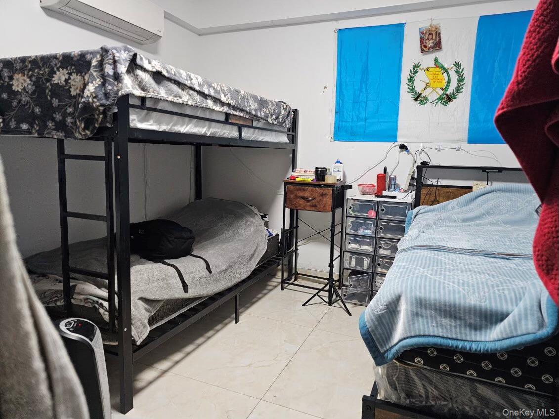 108-38 41st Avenue, Unit 1A Queens, NY 11368 - Photo 8 of 13 a living room with furniture