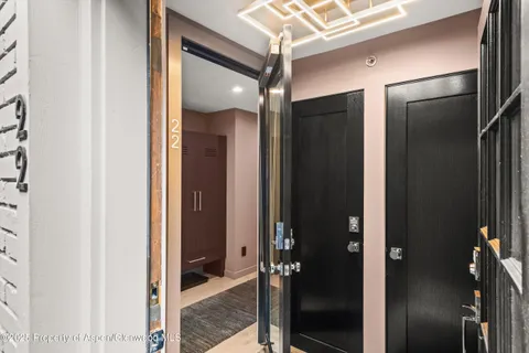 a bathroom with a mirror and a glass door shower