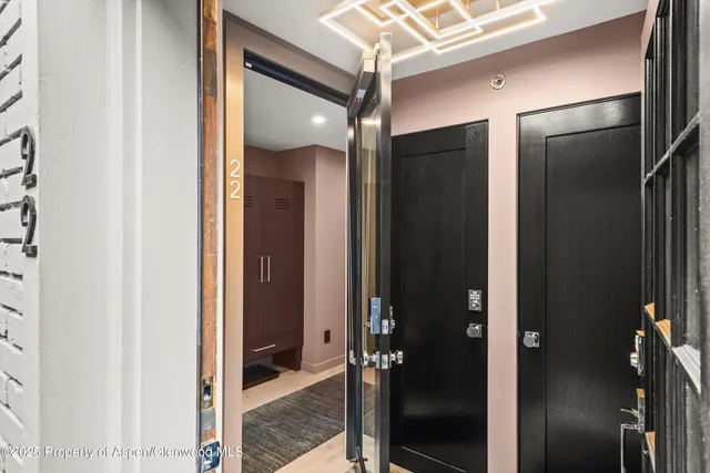 a bathroom with a mirror and a glass door shower