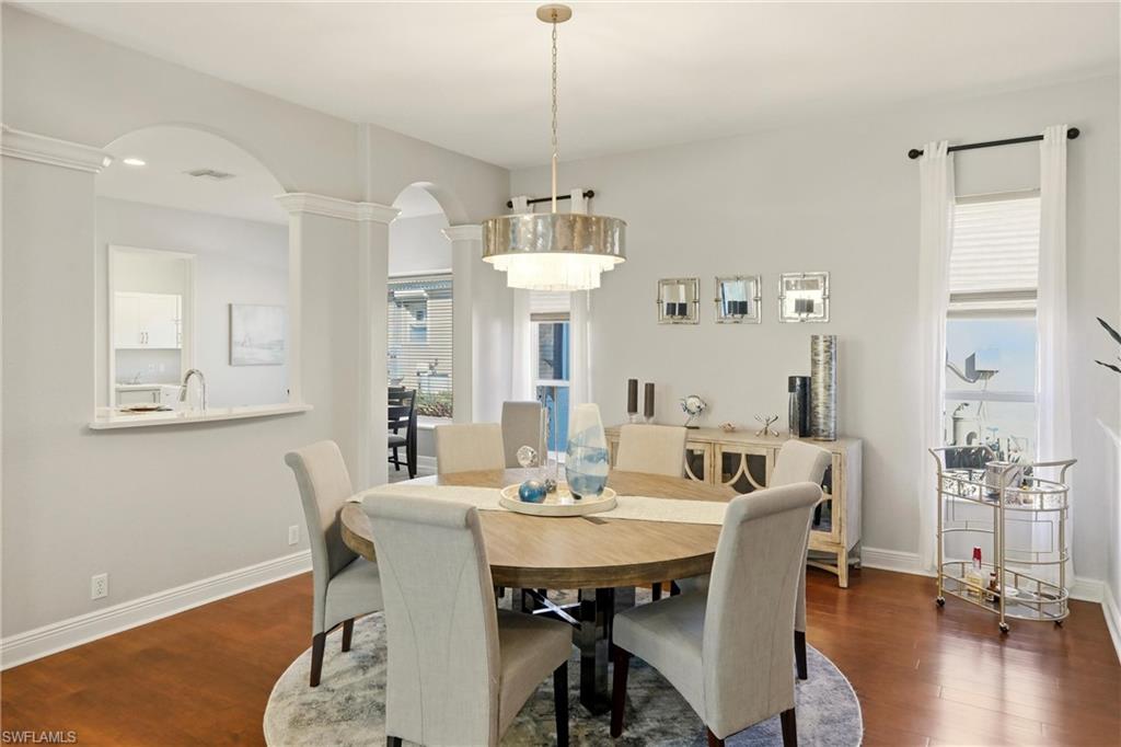 20441 Rookery Drive Estero, FL 33928 - Photo 12 of 41 a view of a dining room with furniture window and wooden floor